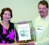 Nadine Roux receiving service award from Michael Pitschlitz